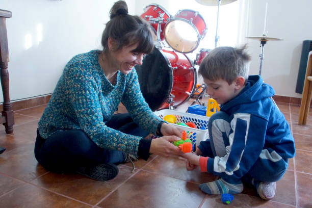 istock mother playing with her son 1169236589