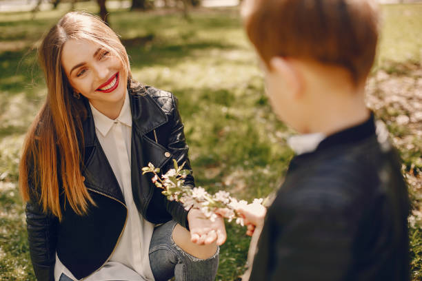 istock Mother with son playing in a summer park 1169236613