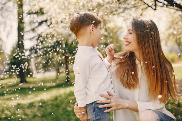 istock Mother with son playing in a summer park 1169237437