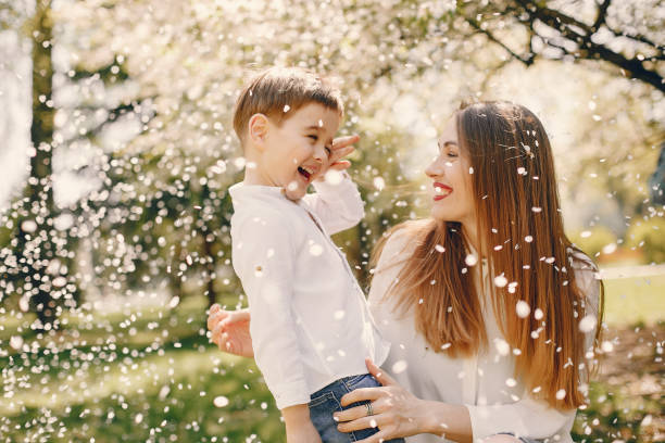 istock Mother with son playing in a summer park 1169237450