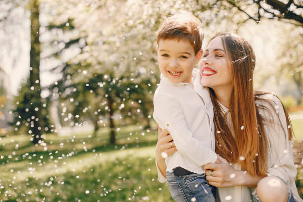 istock Mother with son playing in a summer park 1169237457
