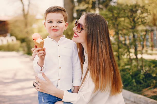istock Mother with son playing in a summer park 1169237482