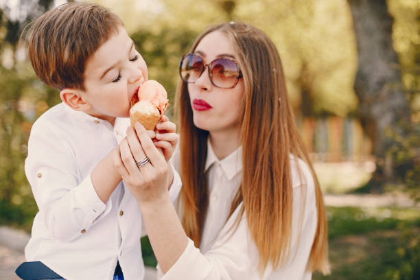 istock Mother with son playing in a summer park 1169237487
