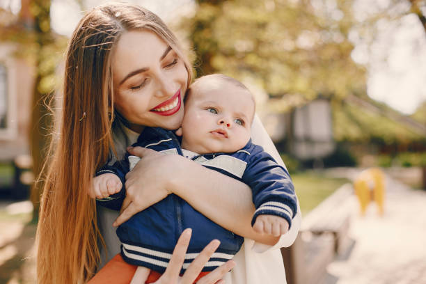 istock Mother with son playing in a summer park 1169237592