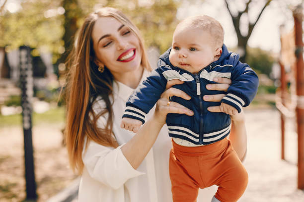 istock Mother with son playing in a summer park 1169237601