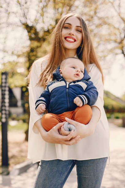 istock Mother with son playing in a summer park 1169237608