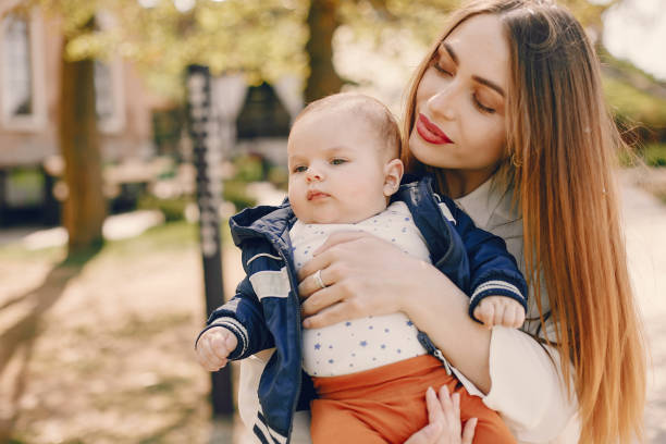 istock Mother with son playing in a summer park 1169237640