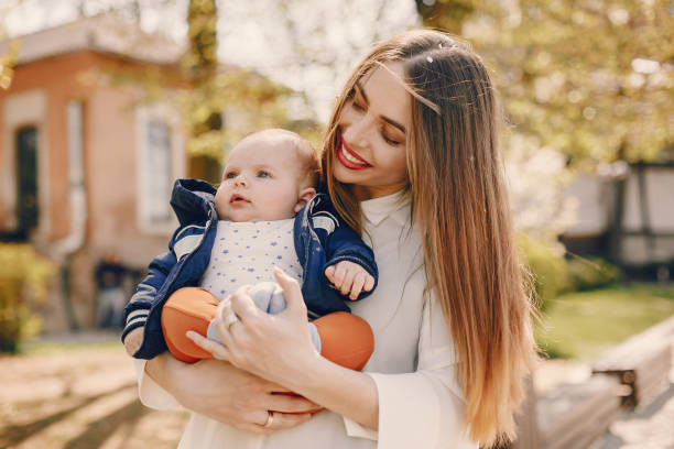 istock Mother with son playing in a summer park 1169237650