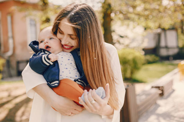 istock Mother with son playing in a summer park 1169237658