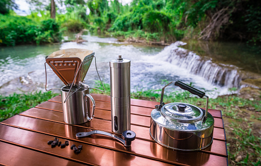 coffee drip while camping near the waterfall