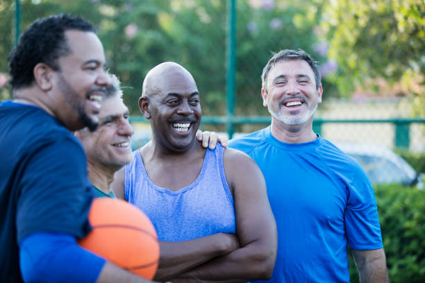 istock Multi-ethnic group of middle aged men playing basketball 1169239454