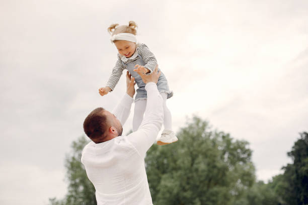 istock Father with daughter playing in a summer park 1169239599