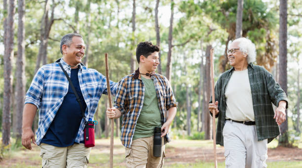 istock Multi-generation Hispanic family hiking in woods 1169242226