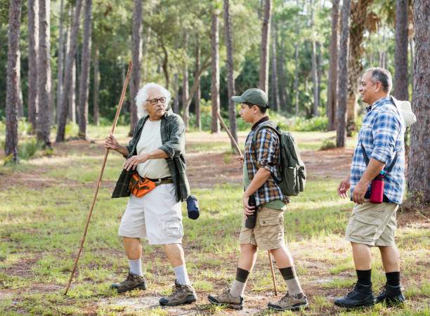istock Multi-generation Hispanic family hiking in woods 1169242288