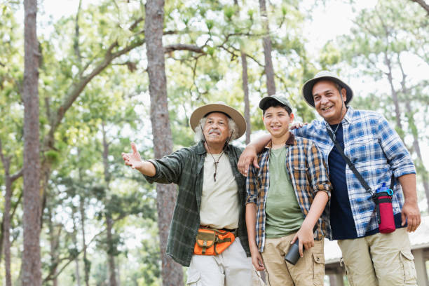 istock Multi-generation Hispanic family hiking in woods 1169242305