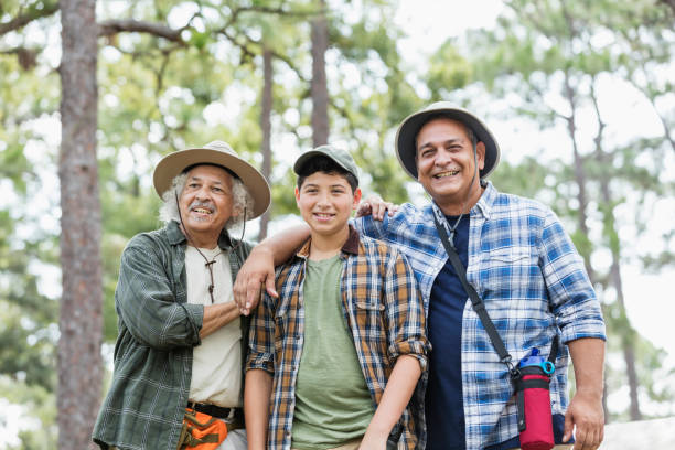 istock Multi-generation Hispanic family hiking in woods 1169242365