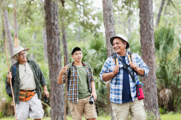 istock Multi-generation Hispanic family hiking in woods 1169242953