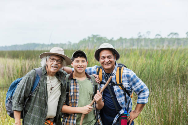 istock Multi-generation Hispanic family hiking in park 1169243065