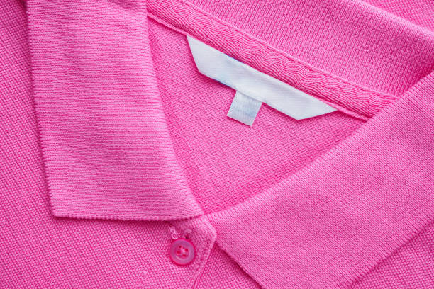 istock Blank white clothes label on new shirt 1169246449