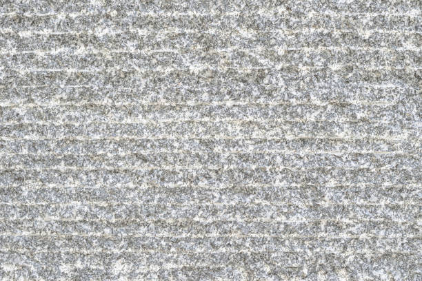 istock Granite stone texture with modern grooved patterned background in natural grey color 1169246590