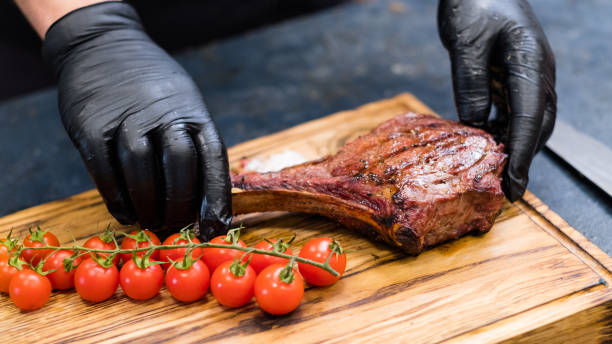 istock steakhouse kitchen cowboy steak cherry tomatoes 1169246731