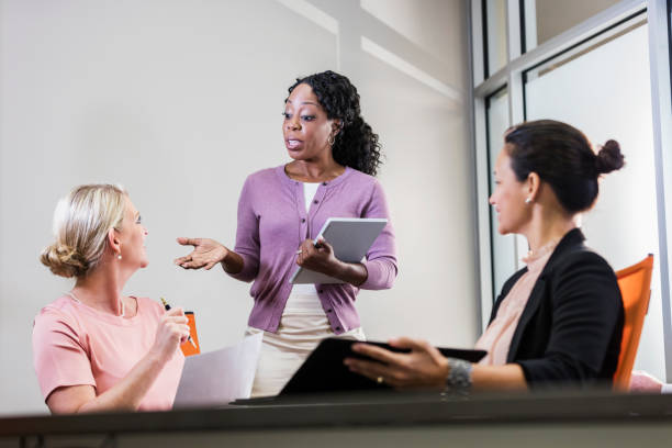 istock Three multi-ethnic businesswomen in meeting 1169253494