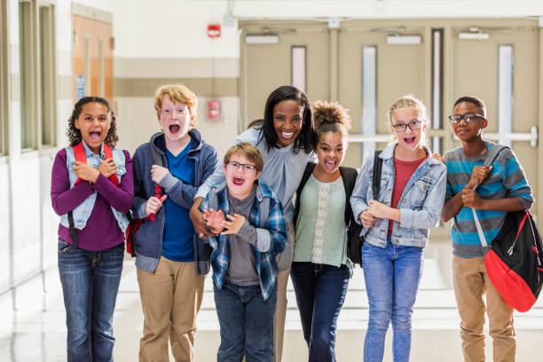 istock Teacher with elementary students and down syndrome boy 1169255935