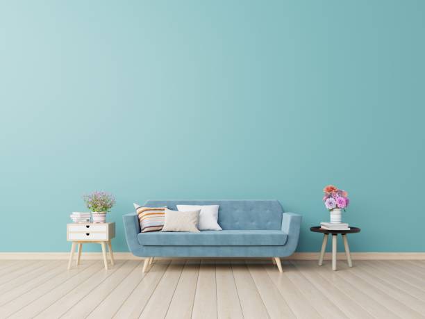 istock Modern living room interior with sofa and green plants,table on blue wall background. 1169257109