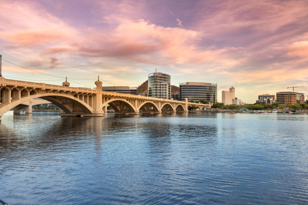 Skyline view panorama of Tempe Arizona and the Mill Avenue bridge Cityscape shore view of downtown Tempe Arizona USA over the Salt River and Mill Avenue Bridge river salt stock pictures, royalty-free photos & images