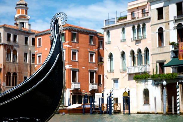 Detail of shiny brass mythological Hippocampus sea horse ornament which adorns both sides of the passenger seat of gondolas in the canals of Venice, Italy.