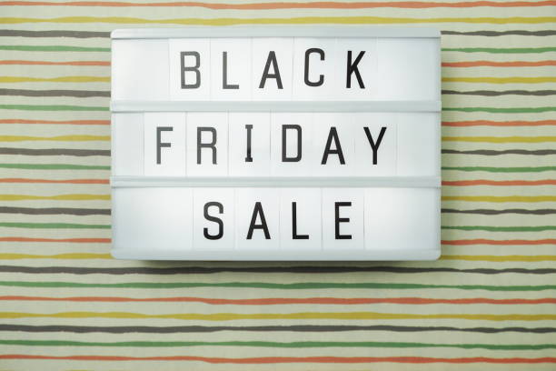 istock Black Friday Sale Word on Lightbox with space copy background 1169264239