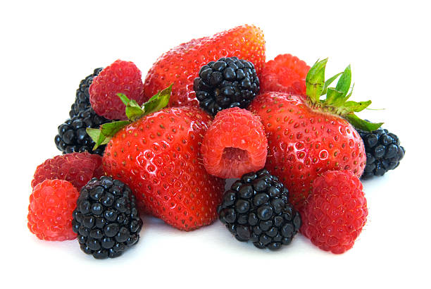 Mix of ripe colorful berries in bowl photography . Blueberry , strawberry , raspberry , blackberry and red currant . Top view on rustic background