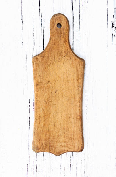 istock Vintage old kitchen utensils on a white wooden background. 1169279316