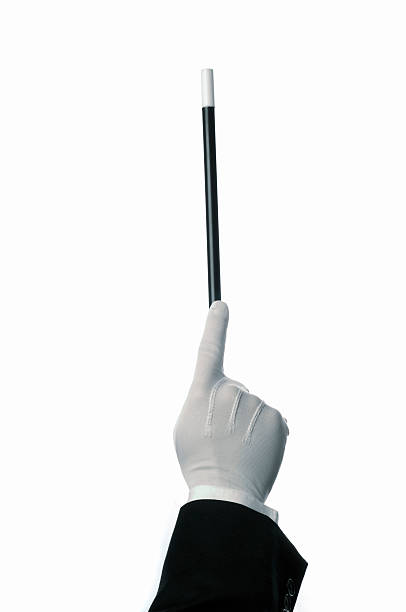 Conductor or magician Magician's hand and wand or a conductor, on white. conductors baton photos stock pictures, royalty-free photos & images