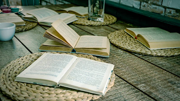 istock Opened books, old table, blank pages, background paper, colored pencils, blank pages, blank, old, vintage, school 1169281101