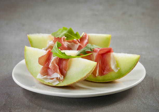 istock Melon slices with prosciutto ham 1169284243