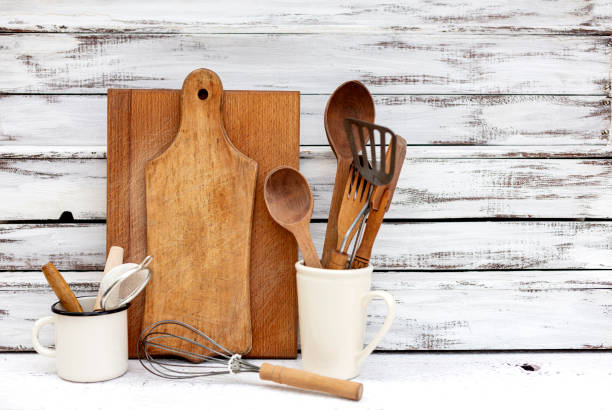 istock Vintage old baking utensils on a white wooden background. 1169285514
