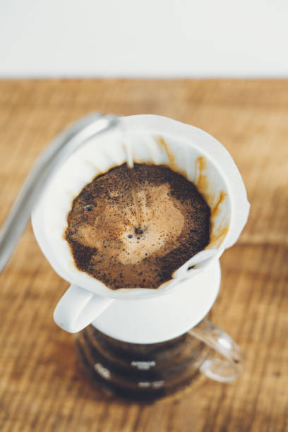 istock Drip coffee make a cup of coffee On the wood background 1169285616