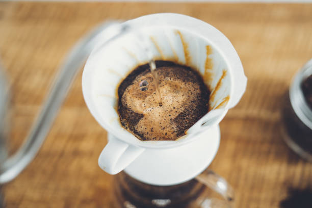 istock Drip coffee make a cup of coffee On the wood background 1169285664