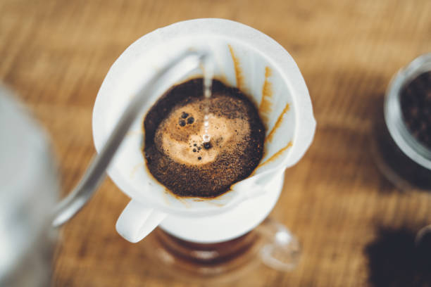 istock Drip coffee make a cup of coffee On the wood background 1169286227