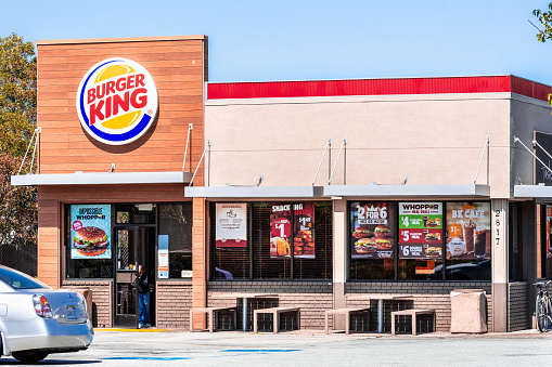 August 19, 2019 San Mateo / CA / USA - Burger King fast food restaurant entrance, advertising several offers among which the Impossible Whopper, a new vegan burger supplied by Impossible Foods