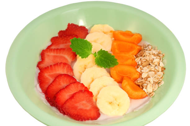 istock Asai Bowl in a plate with fruit and yogurt on a white background 1169290844