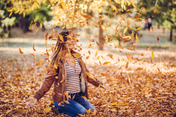 istock Throwing leaves in the air 1169295505