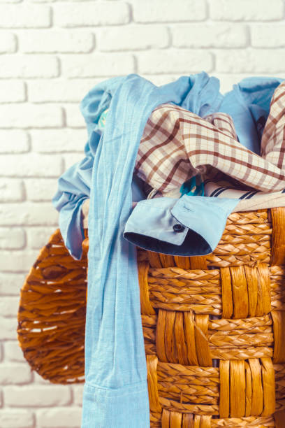 istock Clothes in wooden basket 1169295513