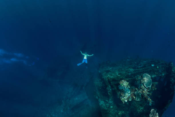 istock Freediver in the depth make ring bubble in underwater 1169295615