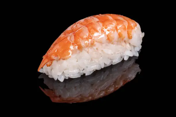 Photo of Japanese food. Sushi and beaters on a black background. Close up.