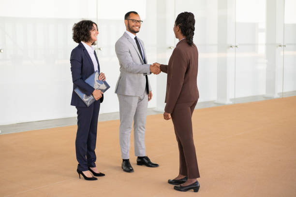istock Happy business partners greeting each other 1169297031