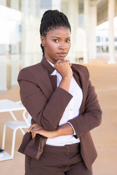 istock Serious confident business professional posing near office 1169298409