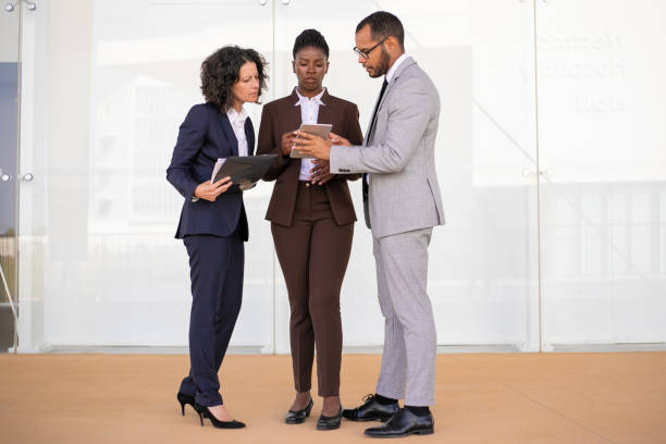 istock Male professional presenting report on tablet 1169298746