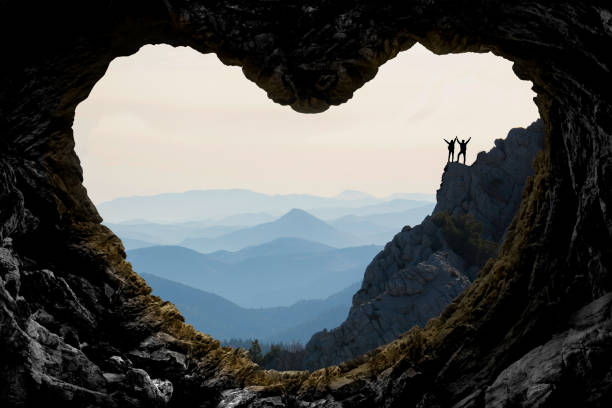 istock success and challenges climbing the rock for victory 1169298809